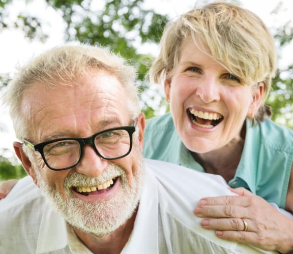 Mature couple with the wife on the back of the husband